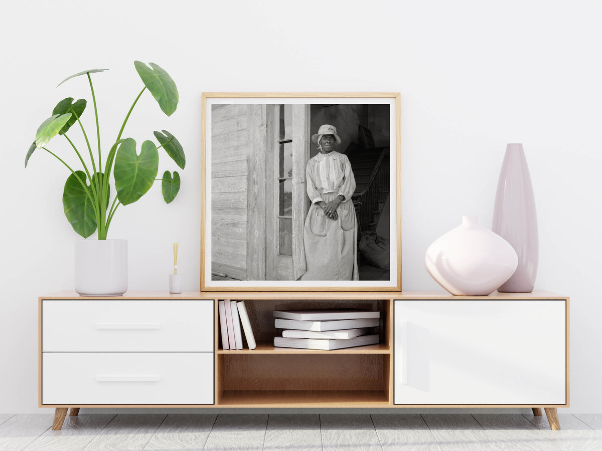 Photo is framed leaning on a wall